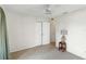 Light-filled bedroom featuring carpet, a ceiling fan, and a convenient closet at 2118 Wells Av, Sarasota, FL 34232