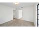 Spacious carpeted bedroom with two doorways offering easy access to other areas at 2118 Wells Av, Sarasota, FL 34232