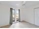 Bright bedroom featuring carpet floors, closet, and two large windows at 2118 Wells Av, Sarasota, FL 34232