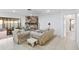 Cozy living room featuring tile floors, stone fireplace, comfortable furniture, and natural light at 2118 Wells Av, Sarasota, FL 34232