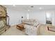 Bright living room featuring a stone fireplace, neutral walls and tile flooring at 2118 Wells Av, Sarasota, FL 34232