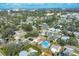 Aerial view of a charming house, with lush greenery, in a Gathering-friendly neighborhood, surrounded by mature trees at 2202 21St W St, Bradenton, FL 34205