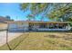 Charming single-story home with a large screened in porch and fenced front yard at 2202 21St W St, Bradenton, FL 34205