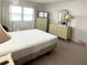 Bedroom with neutral tones, large windows for natural light, and built-in storage at 3236 Sumac Ter, Sarasota, FL 34237