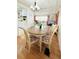 Cozy dining room featuring a wooden table, patterned chairs, and views into the living area at 3236 Sumac Ter, Sarasota, FL 34237