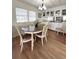 Bright dining room featuring a classic chandelier and views of built-in cabinetry at 3236 Sumac Ter, Sarasota, FL 34237