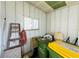 Organized storage area featuring shelving, bins and a small window letting in natural light at 3236 Sumac Ter, Sarasota, FL 34237