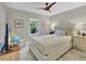 Bedroom showcases a tufted headboard and neutral color palette at 3301 River Woods Dr, Parrish, FL 34219