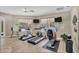 Well-equipped fitness center with treadmills, elliptical, and stationary bike at 3301 River Woods Dr, Parrish, FL 34219