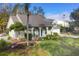 Charming single-story home featuring manicured landscaping, a well-kept lawn, and a double-door entrance at 3301 River Woods Dr, Parrish, FL 34219