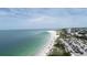 Expansive aerial view of the shoreline with beach and clear water on a sunny day at 344 Monroe Dr, Sarasota, FL 34236