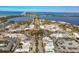 Panoramic view of a coastal town from above, with blue waters, a circular park, and an array of buildings at 344 Monroe Dr, Sarasota, FL 34236