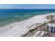 Expansive beach view with soft white sands meeting clear turquoise waters on a sunny day at 344 Monroe Dr, Sarasota, FL 34236