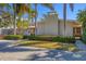 Exterior view of the house showcasing manicured landscaping, a neutral color scheme, and a well-maintained front yard at 344 Monroe Dr, Sarasota, FL 34236