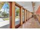 Hallway featuring a wall of windows overlooking the beautifully landscaped yard at 344 Monroe Dr, Sarasota, FL 34236