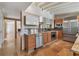 Modern kitchen with stainless steel appliances, custom cabinetry, and travertine flooring at 344 Monroe Dr, Sarasota, FL 34236