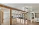 Bright living room showcasing travertine floors, exposed beams, and seamless indoor/outdoor flow at 344 Monroe Dr, Sarasota, FL 34236