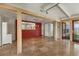 Bright living space with travertine flooring and direct sight lines into another room at 344 Monroe Dr, Sarasota, FL 34236