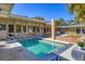 Inviting backyard pool surrounded by the home and patio area, perfect for relaxation at 344 Monroe Dr, Sarasota, FL 34236