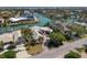 Expansive waterfront estate with private boat docks, a luxurious pool, and lush tropical landscaping at 355 W Royal Flamingo Dr, Sarasota, FL 34236