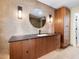 Updated bathroom featuring wood cabinets, modern fixtures, and a large vanity with ample storage at 355 W Royal Flamingo Dr, Sarasota, FL 34236