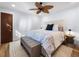 Light and airy bedroom featuring a ceiling fan, stylish décor, and ample natural light at 355 W Royal Flamingo Dr, Sarasota, FL 34236