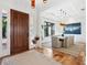 Inviting foyer with hardwood floors and a view into the dining area at 355 W Royal Flamingo Dr, Sarasota, FL 34236