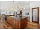 Kitchen features a granite countertop island with walnut cabinetry and modern stainless steel appliances at 355 W Royal Flamingo Dr, Sarasota, FL 34236