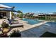 Backyard pool, spa, and patio with lounge chairs overlooking the canal at 355 W Royal Flamingo Dr, Sarasota, FL 34236