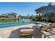 Beautiful outdoor pool area, with lounge chairs, umbrella, and view of the canal at 355 W Royal Flamingo Dr, Sarasota, FL 34236