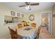 Cozy dining area adjacent to kitchen, featuring a dining table, natural light, and a view of living space at 3863 59Th W Ave # 4189, Bradenton, FL 34210