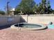 Relaxing hot tub area surrounded by a brick patio and a white fence at 3863 59Th W Ave # 4189, Bradenton, FL 34210