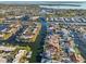 Scenic aerial view of canal-front houses with boat docks and waterfront access to the bay at 4119 Royal Palm Dr, Bradenton, FL 34210