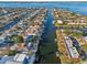 Stunning aerial view of waterfront homes with boat docks and canal access to the open bay at 4119 Royal Palm Dr, Bradenton, FL 34210