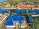 Aerial view of the neighborhood with canals and homes with boat docks at 4119 Royal Palm Dr, Bradenton, FL 34210