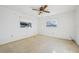 Bedroom with carpet, ceiling fan, and plenty of natural light at 4119 Royal Palm Dr, Bradenton, FL 34210