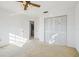 Bright bedroom with ceiling fan and closet at 4119 Royal Palm Dr, Bradenton, FL 34210