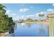 View of the canal with a boat dock and boat at 4119 Royal Palm Dr, Bradenton, FL 34210