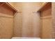 Large empty closet with wooden shelving at 4119 Royal Palm Dr, Bradenton, FL 34210