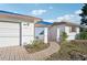 Front exterior of a single-Gathering home featuring a walkway and attached garage at 4119 Royal Palm Dr, Bradenton, FL 34210