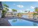 Outdoor pool with calm, clear water and a view of the canal and landscaping at 4119 Royal Palm Dr, Bradenton, FL 34210