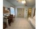 Cozy bedroom with a desk, tiled floors, and a closet at 4197 66Th Street W Cir, Bradenton, FL 34209