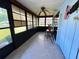 Enclosed sunroom featuring tile floors, a ceiling fan, and lots of natural light at 4197 66Th Street W Cir, Bradenton, FL 34209