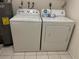 Updated laundry room featuring a Whirlpool washer and dryer at 4197 66Th Street W Cir, Bradenton, FL 34209