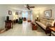 Bright living room is comfortably furnished with tile floors and direct entry access at 4197 66Th Street W Cir, Bradenton, FL 34209