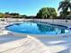 Community pool with lounge chairs is the ideal spot for relaxing and enjoying the Florida sunshine at 4197 66Th Street W Cir, Bradenton, FL 34209