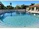 Community pool with plenty of chairs for relaxation and enjoyment on a sunny day at 4197 66Th Street W Cir, Bradenton, FL 34209