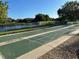 Outdoor shuffleboard courts overlooking a serene lake at 4197 66Th Street W Cir, Bradenton, FL 34209