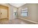 Bright bedroom featuring wood-look floors and two windows, creating a welcoming atmosphere for relaxation and rest at 421 Potenza Loop, Nokomis, FL 34275