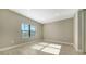 Bright bedroom with natural light, neutral walls, and tile flooring at 421 Potenza Loop, Nokomis, FL 34275